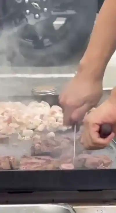 Full backyard hibachi catering setup with dining arrangement NW Florida